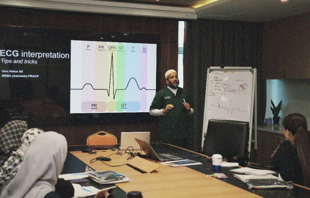 Dr. Onn teaching an ECG interpretation workshop