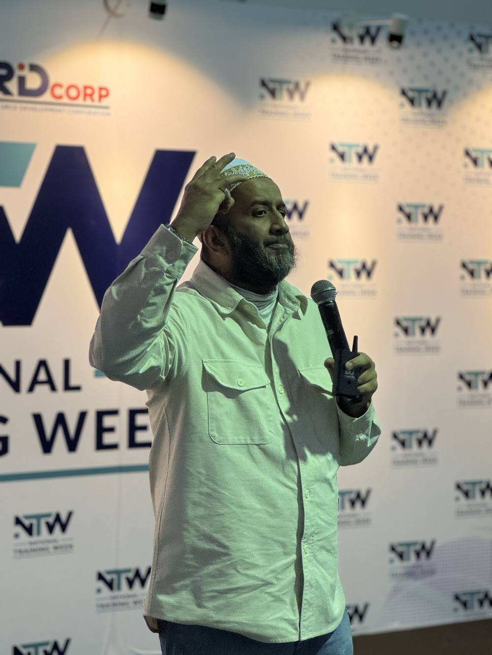 Dr. Onn speaking on stage at a national event