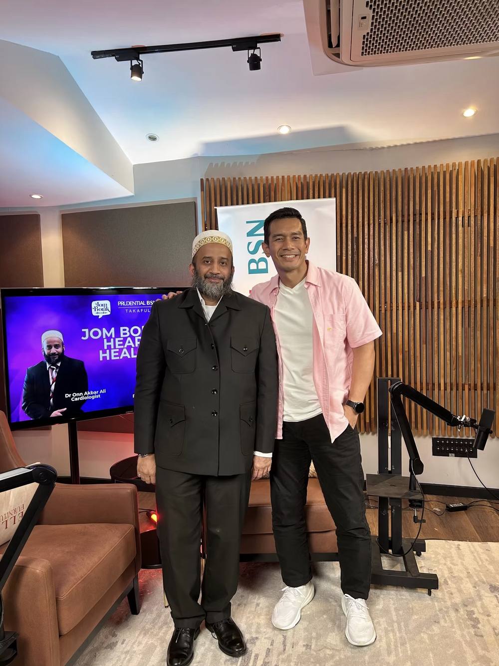Dr. Onn with the host of a heart health podcast